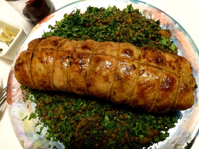 Roasted roulade of duck on a bed of French lentils