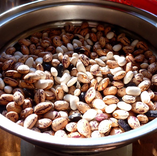 A bowl of mixed dried beans will soak overnight before cooking with savory meat, pork rind, and aromatics