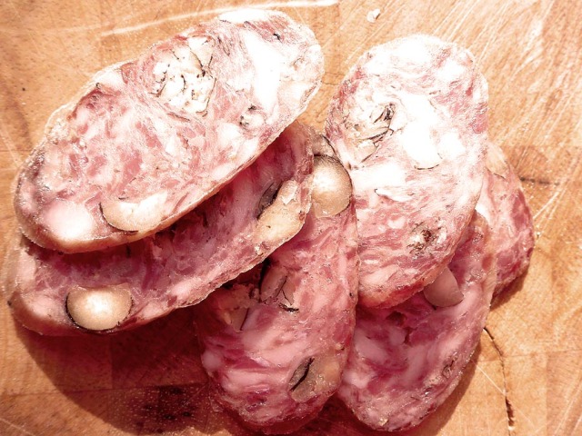 Slices of the saucisse sec with hazelnuts