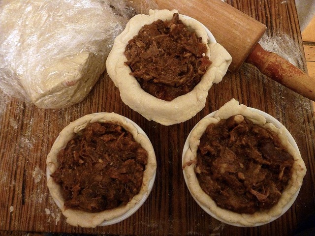 Three make-do pudding basins lined with suet pastry and filled with the oxtail & kidney mixture